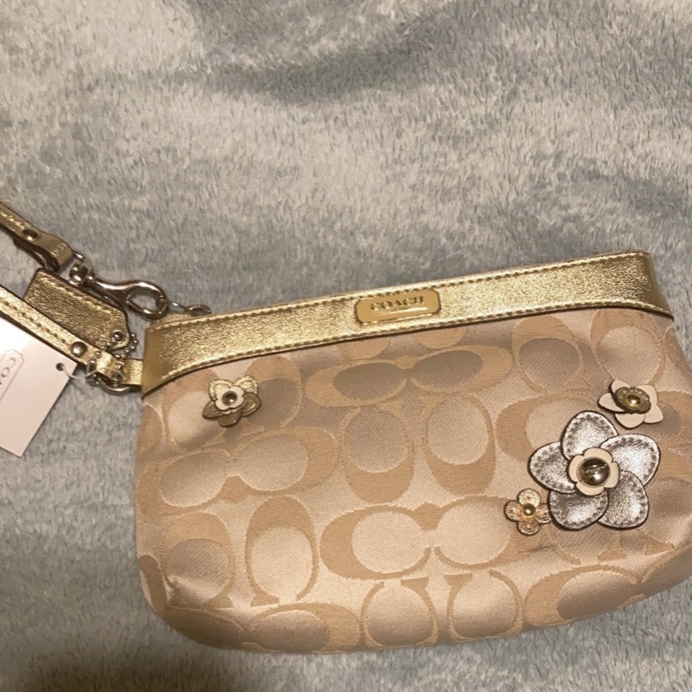 Coach sig. floral Med wristlet